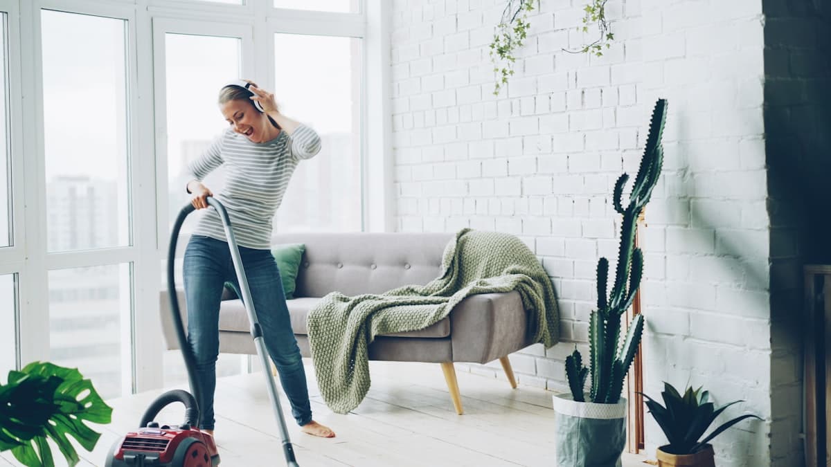 A happy homeowner enjoying a freshly cleaned space